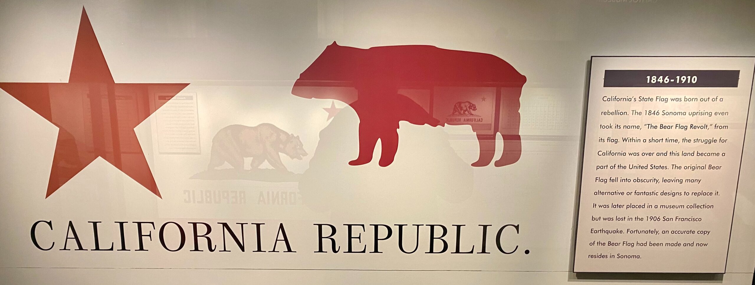 A red star and red bear silhouette on the first California Republic flag from 1846