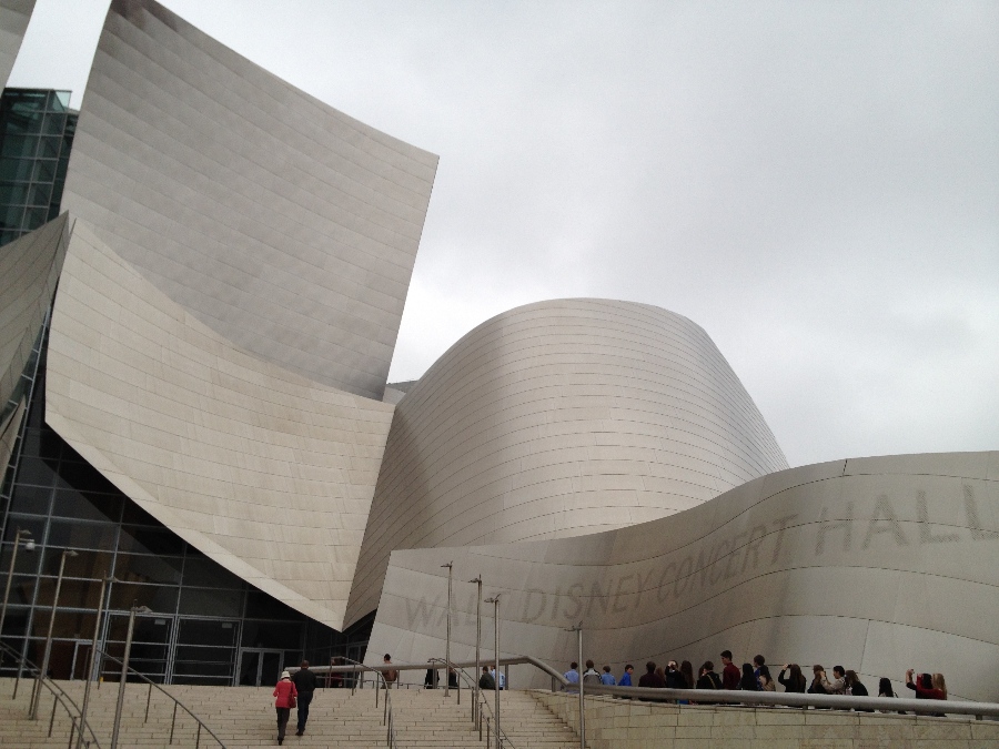 Stainless steel exterior of the desconstructivist architecture of the Walt Disney Concert Hall with a line of people in front